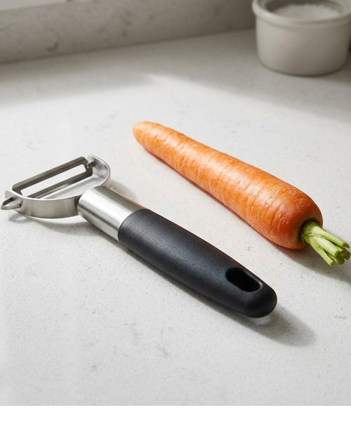 Zpvfg Straight Swivel Stainless Steel Peeler Black Grip - Lifestyle view